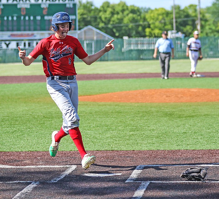 Thomas Verslues of Jefferson City Post 5 scores on Gaven Strobel's sacrifice fly in the third inning of Saturday afternoon's Missouri American Legion state tournament championship game against Lee's Summit at Liberty Park Stadium in Sedalia.