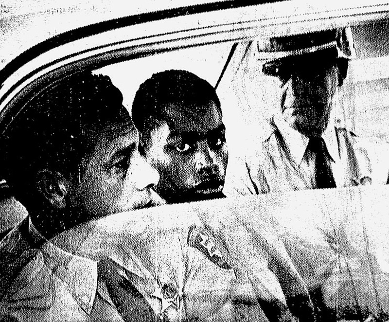 In this February 1964 photo, Henry Montgomery, flanked by two deputies, awaits the verdict in his trial for the murder of Deputy Sheriff Charles H. Hurt in Louisiana. Montgomery, a 71-year-old prisoner who was 17 when he killed a sheriff's deputy, learned Wednesday, June 21, 2017, that he will get a chance at parole, 54 years after the killing and a year after winning his appeal before the U.S. Supreme Court.