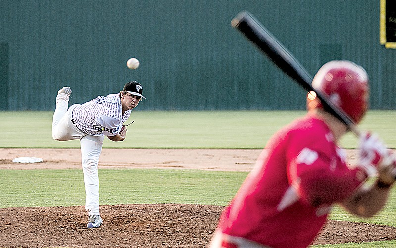 Texarkana Twins' Trey Morris pitches to an Acadiana Cane Cutters batter Monday at George Dobson Field at Spring Lake Park. The Twins came alive in the ninth inning to win, 7-6.