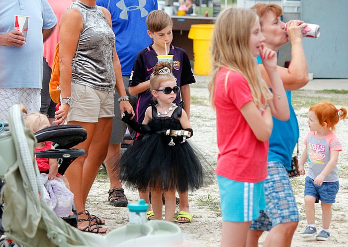 Carys Wieberg waits with her mother before the Little Ms. and Mr. competition on Monday. She won in the 4-5 year old category.