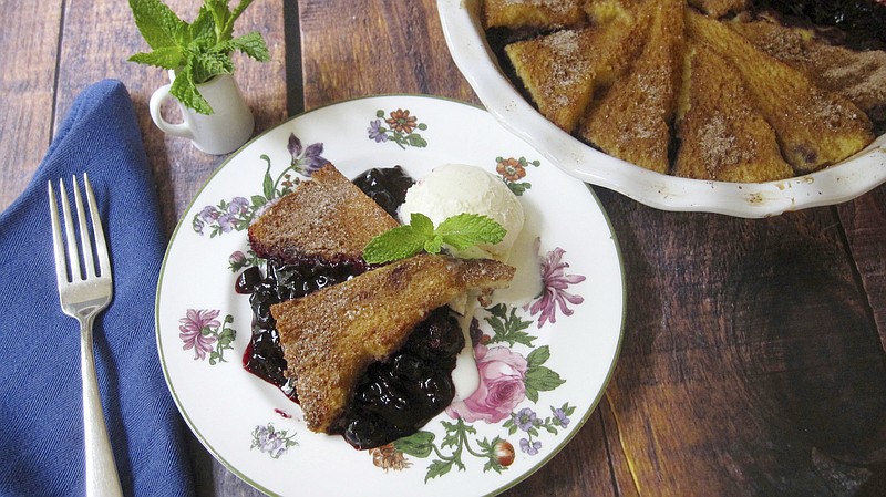 This July 22, 2017 photo shows a blueberry pie with a cinnamon french toast crust in New York. This dish is from a recipe by Sara Moulton. (Sara Moulton via AP)