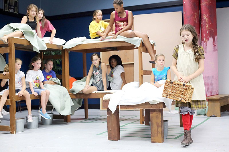 Cailyn Chaney, 12, on right, sings as the character Annie during a rehearsal of the musical "Annie" at the Little Theatre in Jefferson City on Monday, July 31, 2017. 