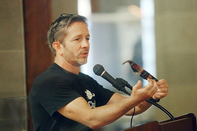 David Ganey, astronomy teacher at Jefferson City High School, explains the need for solar sunglasses during a Museum After Hours presentation Wednesday at the Capitol on the Aug. 21 total solar eclipse.