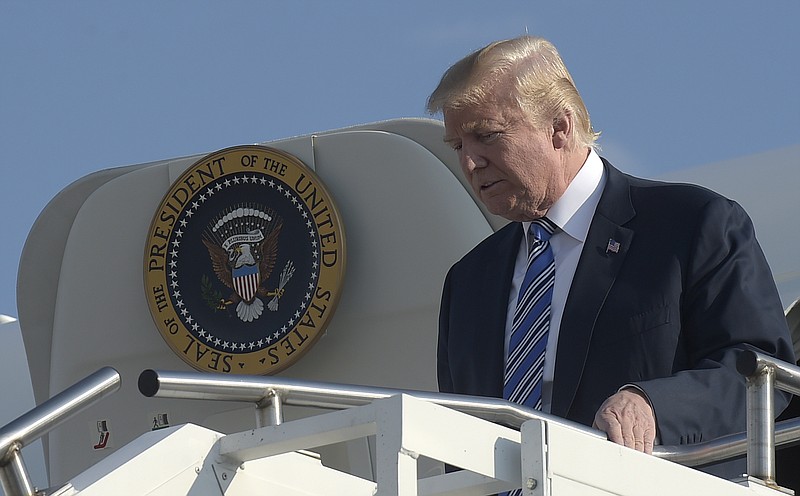 President Donald Trump walks down the steps of Air Force One at Tri-State Airport in Huntington, W.Va., Thursday, Aug. 3, 2017. Trump is in West Virginia for a campaign-style rally in Huntington, W.Va., where it is expected that West Virginia Gov. Jim Justice, a Democrat, will announce at the rally with Trump that he is changing parties. 