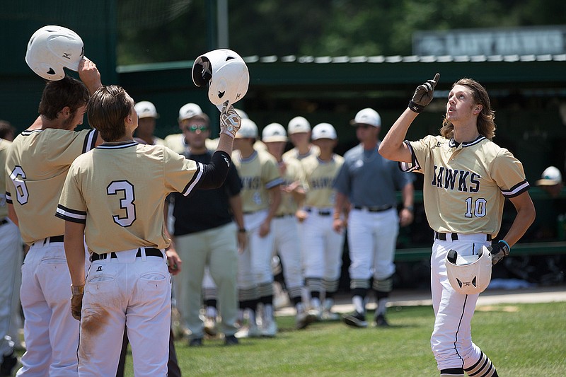 Pleasant Grove's Caleb Bolden points to the sky after scoring a three-run homer in the second inning of a May 13 game against Spring Hill at Hawk Field during the second and final game in the series. PG run-ruled the Panthers in the Class 4A Region II area round. 