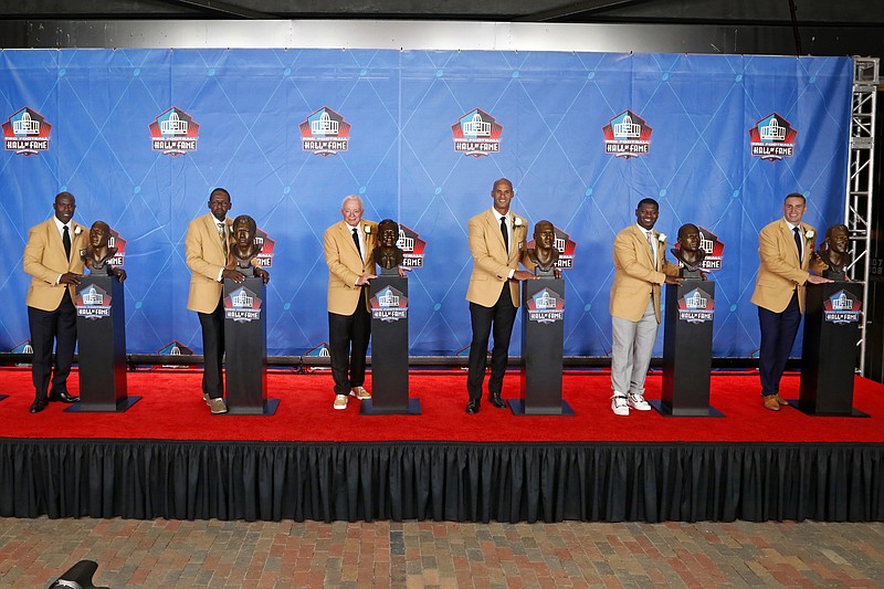 <p>Members of the Pro Football Hall of Fame Class of 2017, minus kicker Morten Andersen, pose with their busts following inductions at the hall Saturday night in Canton, Ohio. From left are Terrell Davis, Kenny Easley, Jerry Jones, Jason Taylor, LaDanian Tomlinson and Kurt Warner. Andersen had left before the photo was taken.</p>