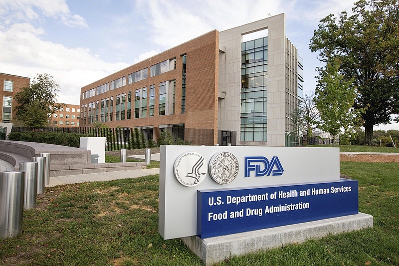 FILE - This Oct. 14, 2015, file photo shows the Food and Drug Administration campus in Silver Spring, Md. The Food and Drug Administration warned a New York fertility doctor on Friday, Aug. 4, 2017, to stop marketing an experimental procedure that uses DNA from three people — a mother, a father and an egg donor — to avoid certain genetic diseases. (AP Photo/Andrew Harnik, File)