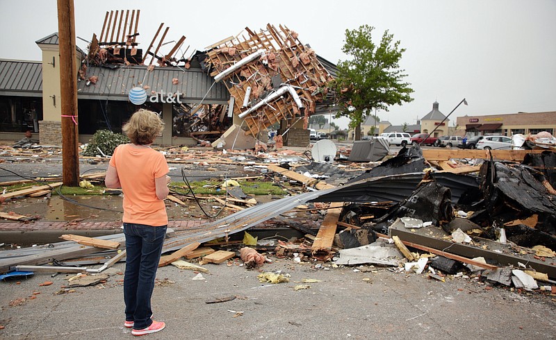 Property manager Gail Fair-Tucker looks at tornado damage at Highland Plaza in Tulsa, Okla., Monday, Aug. 7, 2017.  (Mike Simons/Tulsa World via AP)