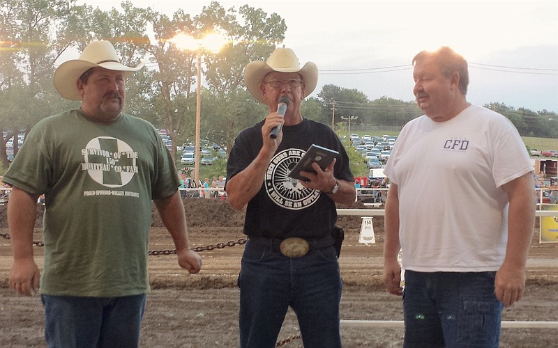 <p>Submitted photo</p><p>Jim Pettigrew, center, who has been known as the “Voice of the Moniteau County Fair,” was honored by Ken Wolken, right, at the Aug. 8 for more than 20 years of announcing the fair. David Staton, left, is the new announcer for the fair.</p>