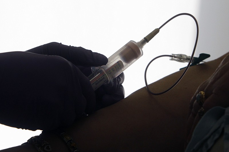 <p>AP</p><p>A patient has her blood drawn for a liquid biopsy during an appointment at a hospital in Philadelphia. Scientists have the first major evidence that such blood tests hold promise for screening people for cancer. Hong Kong doctors tried it for a type of head and neck cancer, and boosted early detection and one measure of survival.</p>
