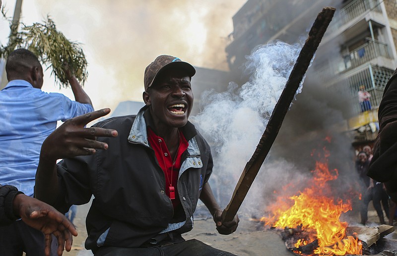 Residents of the Mathare area of Nairobi, Kenya, take to the streets by blocking roads with burning tyres to protest in support of Kenyan opposition leader and presidential candidate Raila Odinga, Wednesday Aug. 9, 2017. Odinga alleges that hackers manipulated the Tuesday election results which appear to show President Uhuru Kenyatta has a wide lead over Odinga. (AP Photo. (AP Photo/Brian Inganga)