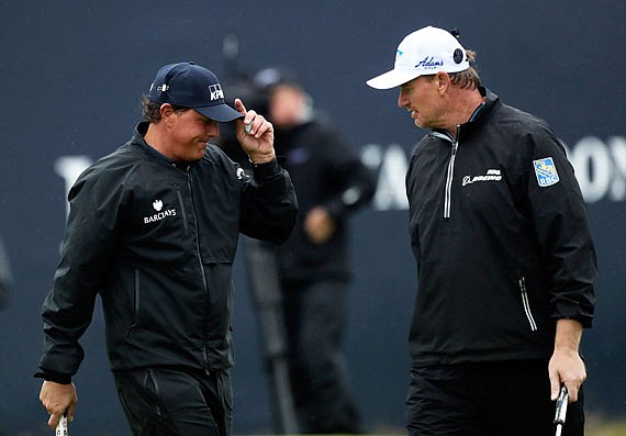 In this July 15, 2016, file photo, Phil Mickelson talks with Ernie Els on the 18th green at the British Open Golf Championship at the Royal Troon Golf Club in Troon, Scotland.