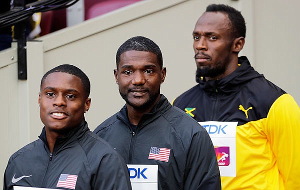 (From left) Christian Coleman, Justin Gatlin and Usain Bolt wait for the start of the medal ceremony for the men's 100-meter dash last Sunday at the World Athletics Championships in London.