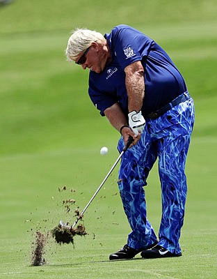 John Daly hits from the fairway on the 18th hole during Thursday's first round of the PGA Championship at the Quail Hollow Club in Charlotte, N.C.