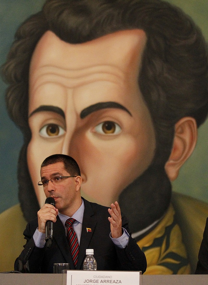 Venezuela's Foreign Minister Jorge Arreaza speaks during a meeting with the diplomatic corps at his offices in Caracas, Venezuela, Saturday, Aug. 12, 2017. Venezuela's government is energetically rejecting US President Donald Trump's talk of a "military option" to resolve the country's political crisis, calling it the most-egregious act of belligerence against the country in a century and a threat to Latin America's stability. The picture at the background is the Venezuelan hero Simon Bolivar (AP Photo/Ariana Cubillos)
