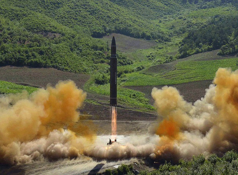 FILE - This file photo distributed by the North Korean government shows what was said to be the launch of a Hwasong-14 intercontinental ballistic missile, ICBM, in North Korea's northwest, Tuesday, July 4, 2017. Independent journalists were not given access to cover the event depicted in this photo. No need to duck and cover just yet. U.S. intelligence officials are pretty sure North Korea can put a nuclear warhead on an intercontinental missile that could reach the United States. Experts aren’t convinced the bomb could survive the flight to America. (Korean Central News Agency/Korea News Service via AP, File)