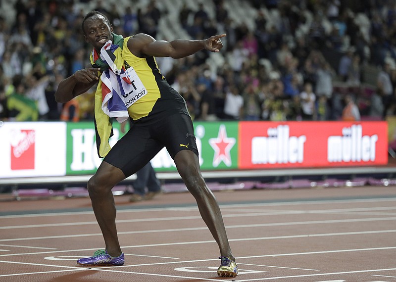 Jamaica's Usain Bolt performs his trademark pose on the finish line after placing third in the men's 100m final during the World Athletics Championships on Saturday in London.