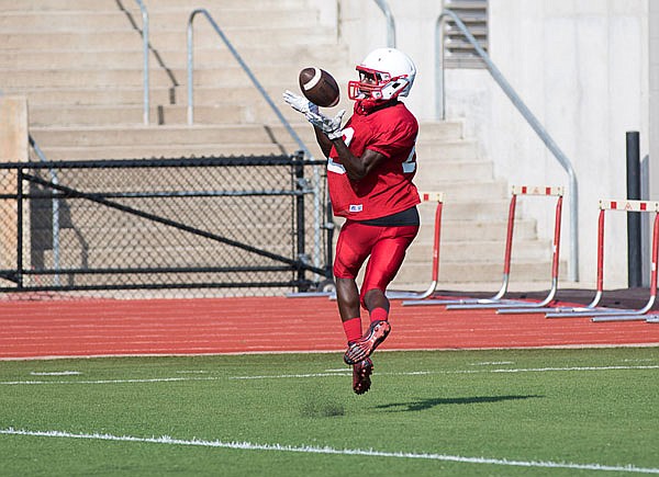 Jays receiver Christian White hauls in a touchdown during Friday night's scrimmage at Adkins Stadium. 