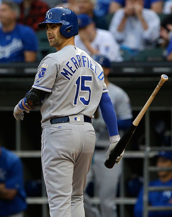 Whit Merrifield of the Royals looks at White Sox starting pitcher Reynaldo Lopez after being called out on strikes during the first inning of Friday night's game in Chicago. 