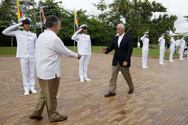 <p>AP</p><p>U.S. Vice President Mike Pence is welcomed Sunday by Colombia’s President Juan Manuel Santos, left, at the presidential guesthouse in Cartagena. Cartagena is the first stop of Pence’s weeklong trip to Latin America, that will also take him to Argentina, Chile and Panama.</p>