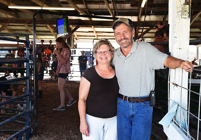 Cindy and William Kautsch pose at the entrance to the show barn at the Cole County Fair. The pair are very involved with 4-H and will be inducted into the 4-H Hall of Fame. 