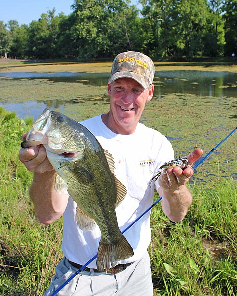 Giant bass like this one Brad Wiegmann caught can be taken on the surface in summer. (Contributed photo)