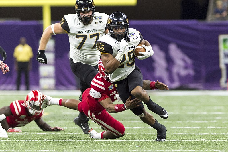 Southern Mississippi's Ito Smith runs the ball Dec. 17, 2016, during the New Orleans Bowl against Louisiana-Lafayette in New Orleans. Smith has rushed for more than 100 yards in 16 games already at Southern Miss. He is the league's top returning rusher after averaging 112 yards per game as a junior.