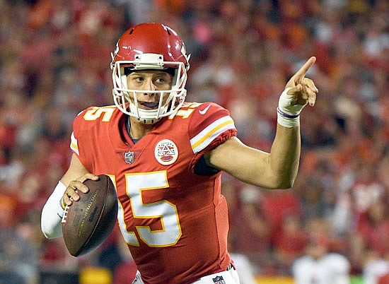 Chiefs quarterback Patrick Mahomes points for his receiver to go down the field during Friday night's preseason game against the 49ers at Arrowhead Stadium.
