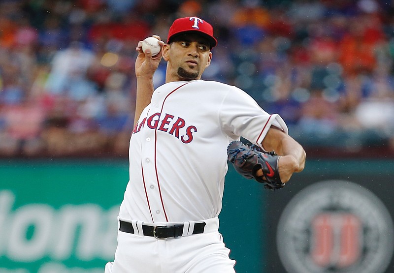 Texas Rangers starting pitcher Tyson Ross throws during the first inning of a baseball game against the Houston Astros on Saturday in Arlington, Texas.