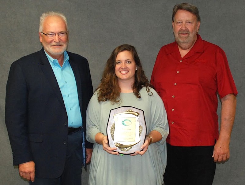 Ellen Amos, agriculture educator at Russellville High School, was recognized by the Missouri Vocational Agriculture Teachers Association at the district and state level. Pictured, from left to right, are Richard Roller, Seitz Fundraising; Amos; and David Wells, Seitz Fundraising. (Submitted photo)