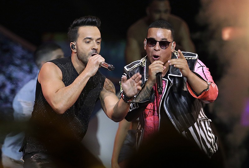 FILE - This April 27, 2017, file photo shows singers Luis Fonsi, left, and Daddy Yankee during the Latin Billboard Awards in Coral Gables, Fla. An MTV spokesperson said in a statement to The Associated Press on Monday, Aug. 14, 2017, that the ‘Despacito’ video was not submitted for consideration for nomination at the 2017 Video Music Awards. The hit song’s video has not aired on MTV or MTV2, but is being played on MTV Tres, the company’s Latin channel. Universal Music Latin Entertainment, the label that released Luis Fonsi and Daddy Yankee’s “Despacito,” said they welcome MTV to play Spanish videos on its main channel in a statement to the AP. (AP Photo/Lynne Sladky, File)