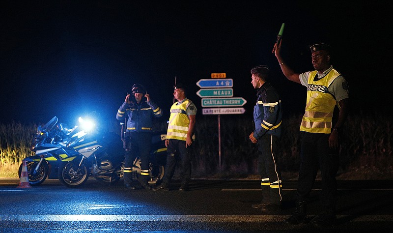 <p>AP</p><p>French police block the road approaching the scene of an incident when a driver slammed his car into the sidewalk cafe of a pizza restaurant in in Sept-Sorts, a town about 40 miles east of Paris.</p>