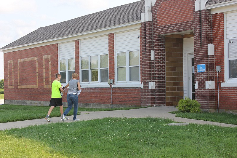 <p>Democrat photo/ Kevin Labotka</p><p>A student enters the school during the open house at Prairie Home school on Aug. 14.</p>