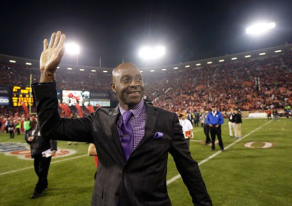 In this Dec. 23, 2013, file photo, former 49ers player Jerry Rice waves to the crowd at Candlestick Park after an NFL football game between the 49ers and the Falcons in San Francisco.