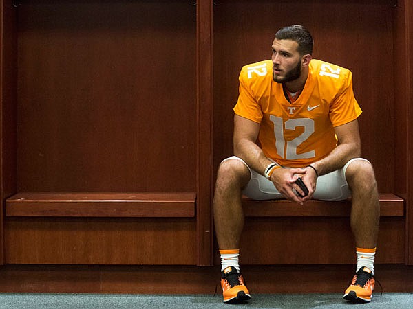 Tennessee quarterback Quinten Dormady sits at his locker during Sunday's media day in Knoxville, Tenn.