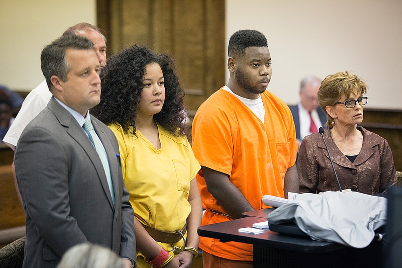 Tenescha Wilkerson, center, and Joshua King, right, listen to 9th Judicial Court Judge Tom Cooper explain the charges filed against them Tuesday in the Ashdown, Ark., courtroom. Wilkerson and King were allegedly involved in a fatal drive-by shooting in Ashdown.
