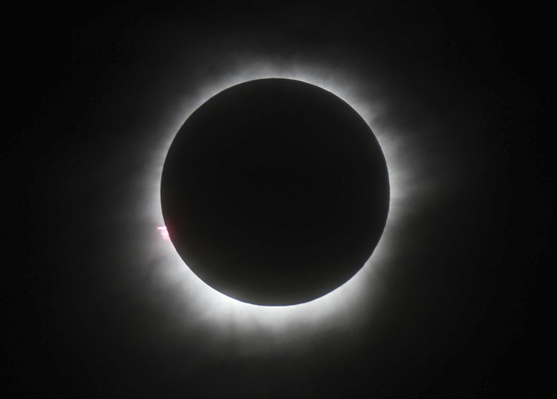 FILE - This March 9, 2016, file photo shows a total solar eclipse in Belitung, Indonesia. A solar eclipse on Monday, Aug. 21, 2017, is set to star in several special broadcasts on TV and online. PBS, ABC, NBC, NASA Television and the Science Channel are among the outlets planning extended coverage of the first solar eclipse visible across the United States in 99 years. (AP Photo/File)