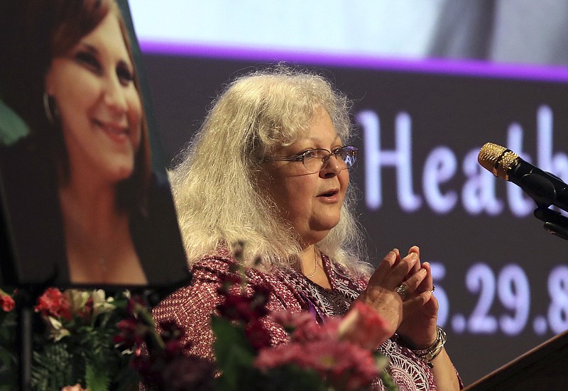 Susan Bro, mother to Heather Heyer, speaks during a memorial for her daughter, Wednesday, Aug. 16, 2017, at the Paramount Theater in Charlottesville, Va.  Heyer was killed Saturday, when a car rammed into a crowd of people protesting a white nationalist rally.  (Andrew Shurtleff/The Daily Progress via AP, Pool)