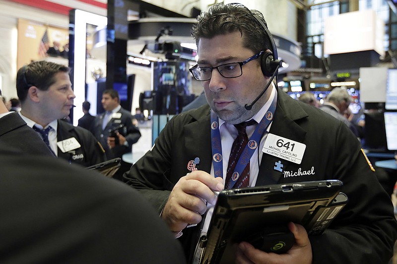 Trader Michael Capolino works on the floor of the New York Stock Exchange, Wednesday, Aug. 16, 2017. Stocks are opening higher on Wall Street following some encouraging results from retailers. (AP Photo/Richard Drew)