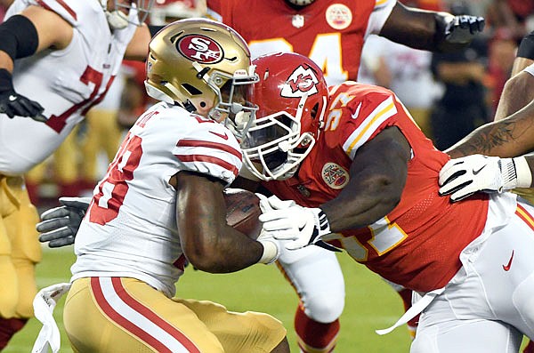 49ers running back Carlos Hyde is tackled by Chiefs defensive lineman Allen Bailey during the first half of last Friday's preseason game at Arrowhead Stadium in Kansas City.