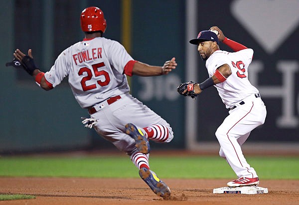 Red Sox second baseman Eduardo Nunez forces out Cardinals center fielder Dexter Fowler for the second out of a triple play during the fourth inning of Tuesday night's game at Fenway Park in Boston.