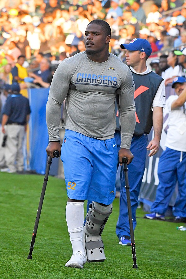 Chargers inside linebacker Denzel Perryman walks with a boot on the sidelines during the second half of Sunday's preseason game against the Seahawks in Carson, Calif.