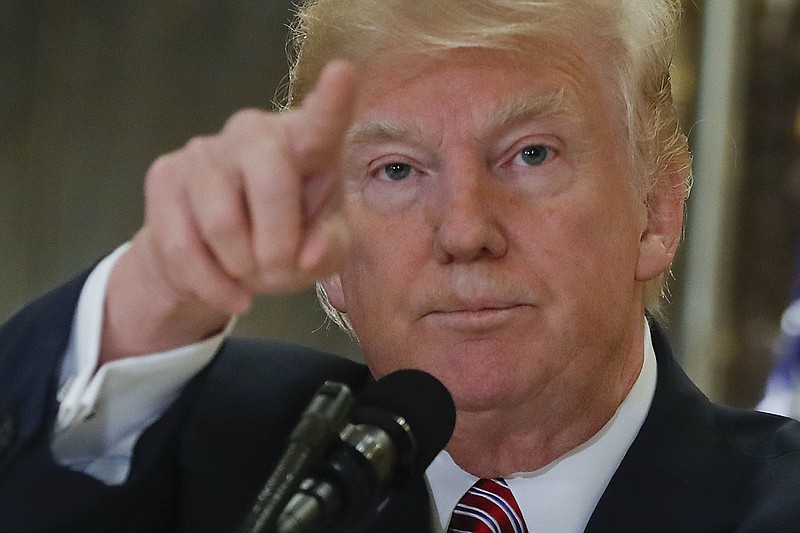 In this Aug. 15, 2017, photo, President Donald Trump points to members of the media as he answers questions in the lobby of Trump Tower in New York. Republican leaders on Wednesday tiptoed around Trump's extraordinary comments on white supremacists.  (AP Photo/Pablo Martinez Monsivais)