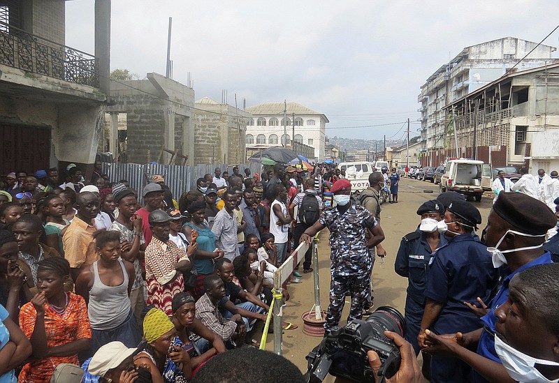 Family of victims of heavy flooding and mudslides in Regent wait to identify their bodies at Connaught hospital morgue in Sierra Leone, Freetown, Wednesday, Aug. 16 , 2017. Family members lined up in the pouring rain to identify their loved ones’ remains following mudslides and floods in the capital that killed more than 300 people. The death toll is expected to rise as search efforts continue, and the risk of further mudslides remains. (AP Photo/ Manika Kamara)