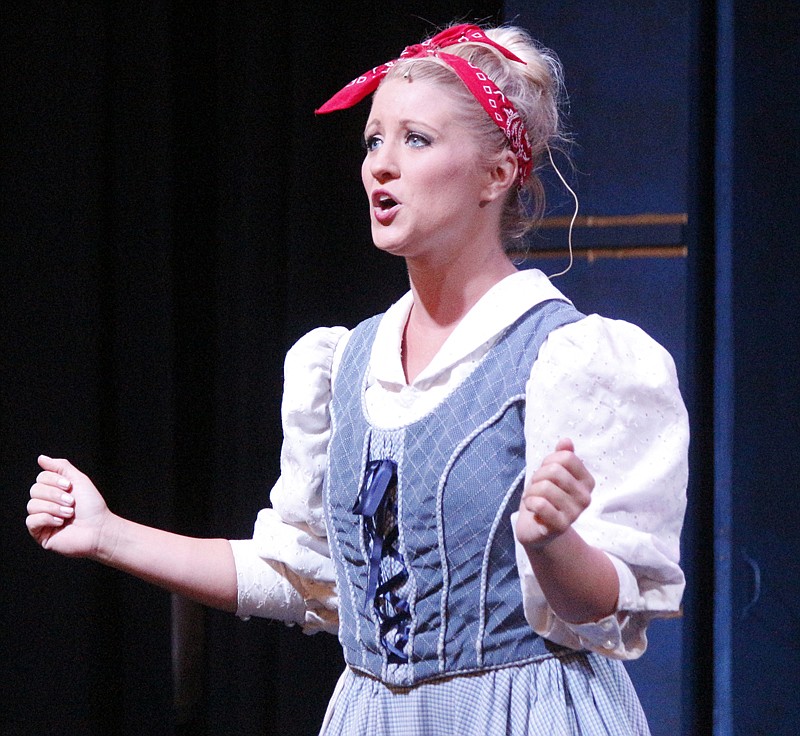 Belle, played by Tori Stepanek, gracefully sings during a rehearsal for Beauty and the Beast Aug. 7 at Shikles Auditorium.