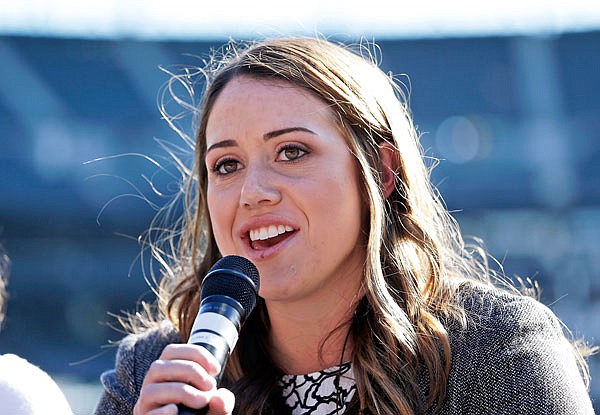 Amanda Hopkins talks on a panel on women in baseball before Tuesday's game between the Mariners and the Orioles in Seattle.