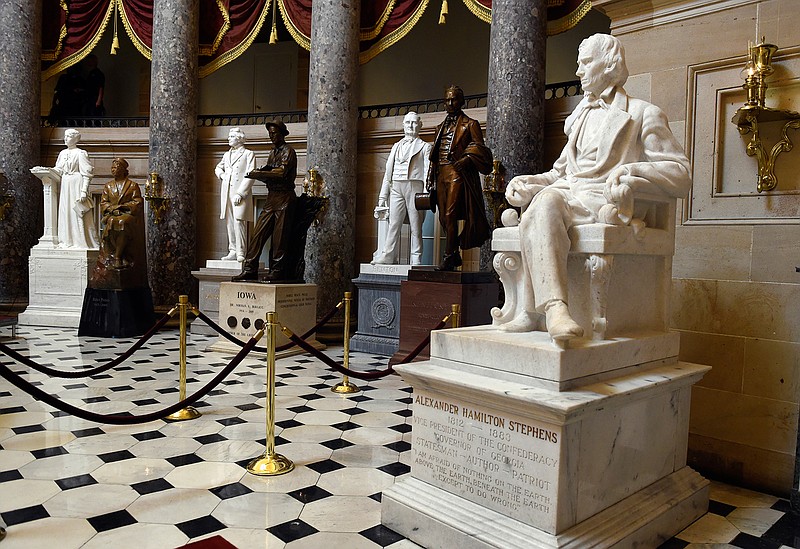 In this June 24, 2015 file photo, a statue of Alexander Hamilton Stephens, the Confederate vice president throughout the American Civil War, is on display in Statuary Hall on Capitol Hill in Washington. House Minority Leader Nancy Pelosi of Calif is calling for the removal of Confederate statues from the U.S. Capitol as the contentious debate over the appropriateness of such memorials moves to the halls of Congress. 