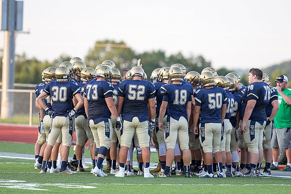 Helias coach Tim Rulo talks to the Crusaders during a break in last Friday night's Jamboree in Wardsville.