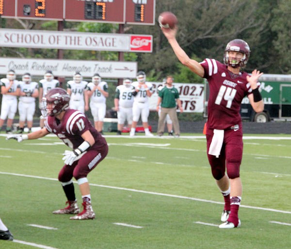 School of the Osage quarterback Zach Wheeler throws a pass during a game last season against Warsaw in Lake Ozark.