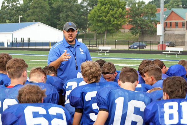 South Callaway head coach Zack Hess talks with his players before the start of practice last week in Mokane. The Bulldogs kick off the 2017 season tonight with a trip to Columbia to face Father Tolton.